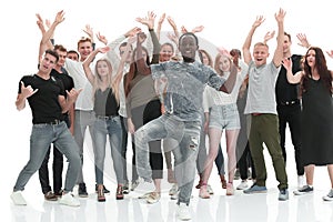 Leader standing in front of a cheerful group of young people