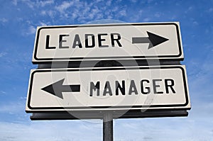 Leader vs manager sign two arrows on a pole pointing in different directions