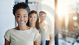 Leaders of the industry. a group of businesspeople standing in the office.