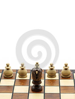 Leadership Concept: Black King Chess Piece With White Pawns