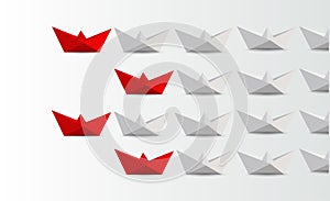 Leadership concept. red paper boats leading white.