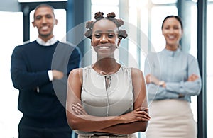 Leadership, female empowerment and proud business woman standing with her team and smiling with her arms crossed