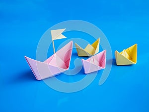 Leadership and team work concept, Craft of paper boat group Or