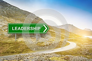Leadership words on green road sign