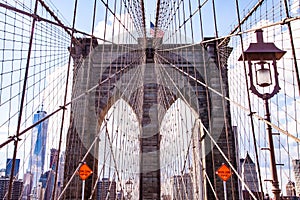 Leading Lines, American flag, street light and orange signs on the Brooklyn Bridge photo