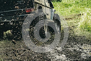 Leading up through the extreme trails. SUV or offroader on mud road. Car racing offroad. Offroad car in action. Dirty