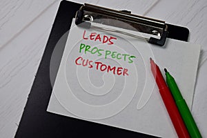 Leads, Prospects, Customer text on sticky notes isolated on office desk