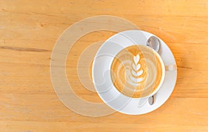 Leaf latte art in while cup