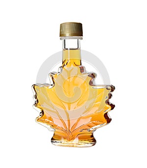 Leaf shaped bottle of delicious maple syrup isolated on white