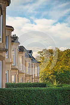 A Leafy Street in Glasgow Scotland in Autumn with a Row of Blonde Sandstone Houses