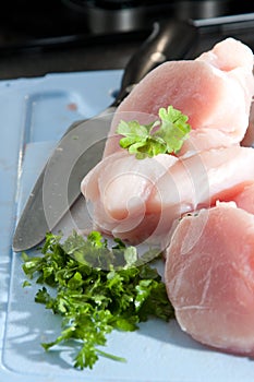 Lean chicken pieces with chopped parsley