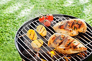 Lean healthy chicken breasts on a BBQ