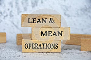 Lean and mean operations text on wooden blocks. Business strategy concept