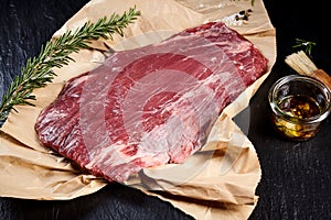 Lean raw flank steak for roasting or grilling photo
