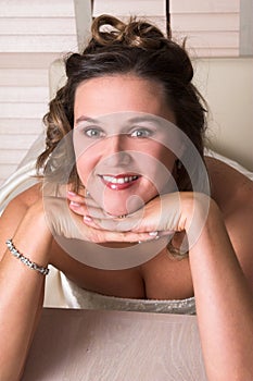 Leaning on her hands