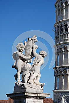 Leaning Pisa Tower and statue