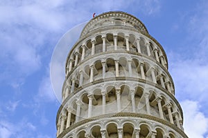 leaning tower of Pisa from beneath across the blue sky. Travel to Tuscany, Italy.