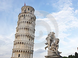 The leaning tower of Pisa and Piazza dei Miracoli in a sunny day - The Miracle Square, the Leaning Tower and the Cathedral is