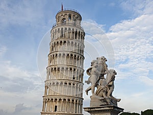 The leaning tower of Pisa and Piazza dei Miracoli in a sunny day - The Miracle Square, the Leaning Tower and the Cathedral is