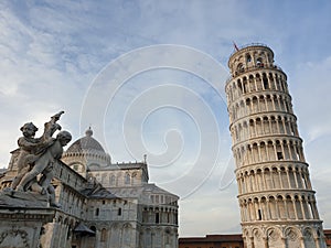 The leaning tower of Pisa and Piazza dei Miracoli in a sunny day - The Miracle Square, the Leaning Tower and the Cathedral is