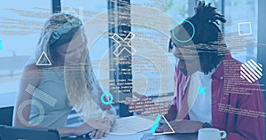 Leaning woman and man in red jacket annotating blueprints at office, tablet and pen