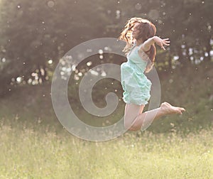 Leap in the sky.enthusiastic young woman enjoying freedom