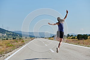 Leap of Victory: Athlete Symbolizes Success and Dedication Through Mid-Air Jump.