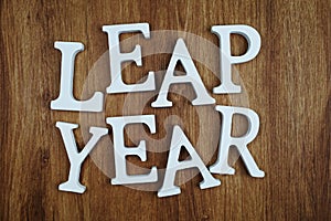 Leap Year alphabet letter with space copy on wooden background