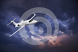 Learjet 45 with Storm Clouds photo