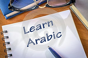 Learn arabic written in a notepad