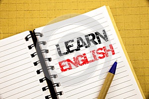 Learn English. Business concept for Language School written on notepad with copy space on old wood wooden background with pen mark