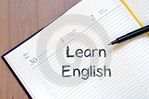 Learn english write on notebook