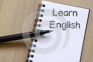 Learn english write on notebook