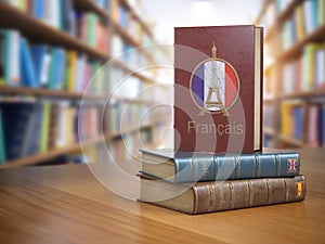 Learn French concept. French dictionary book or textbok with fla