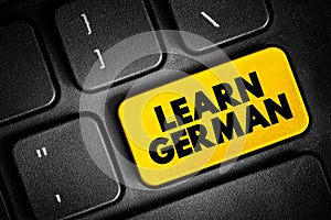 Learn German text button on keyboard, concept background