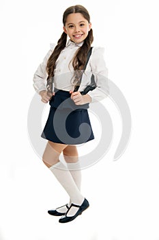 Learn how fit backpack correctly for school. Schoolgirl cute in formal uniform wear backpack. School backpack concept