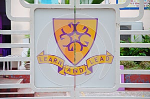 Learn and lead sign on the gates of school