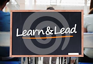 Learn and lead written on blackboard