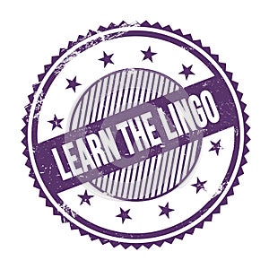 LEARN THE LINGO text written on purple indigo grungy round stamp