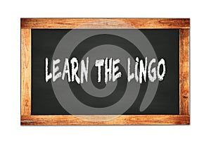 LEARN  THE  LINGO text written on wooden frame school blackboard