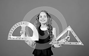 Learn mathematics. Theorems and axioms. Smart and clever concept. Sizing and measuring. Girl with big ruler. School photo