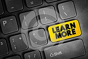 Learn More text button on keyboard, concept background