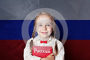 Learn russian language. Child girl student with book