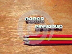 Learn Spanish and colored pencils photo