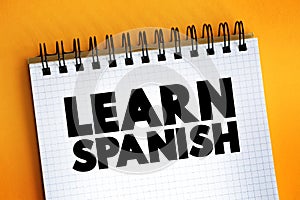 Learn Spanish text on notepad, concept background