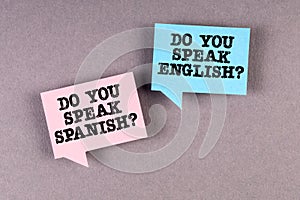 Learn and speak English and Spanish. Two speech bubbles on a gray background