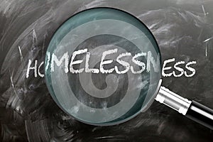 Learn, study and inspect homelessness - pictured as a magnifying glass enlarging word homelessness, symbolizes researching, photo