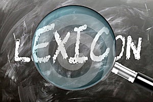 Learn, study and inspect Lexicon. A magnifying glass enlarging word \'lexicon\' written on a blackboard photo