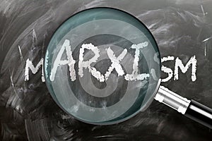 Learn, study and inspect marxism - pictured as a magnifying glass enlarging word marxism, symbolizes researching, exploring and