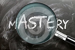 Learn, study and inspect mastery - pictured as a magnifying glass enlarging word mastery, symbolizes researching, exploring and photo